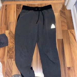 reebok sweat pants. dark gray with black waist and bottoms.